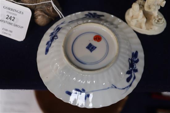 A Chinese blue and white tea bowl and saucer and two jars, Kangxi, some damage, largest diameter 11cm